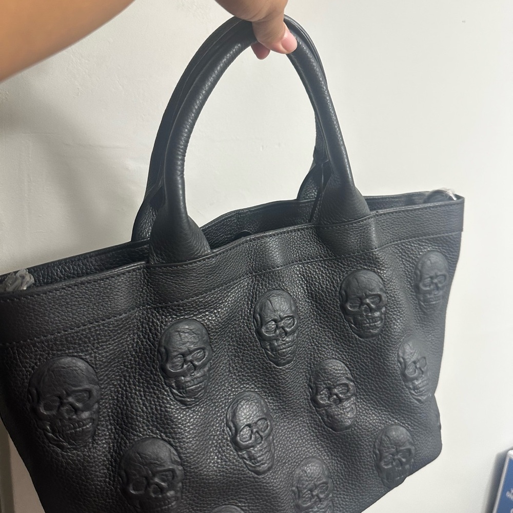 betsy johnson? Black Skull Embossed Tote Bag
